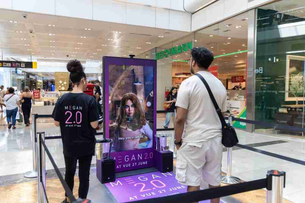 M3GAN 2.0 AI character on an Ocean Outdoor screen at Westfield Stratford City